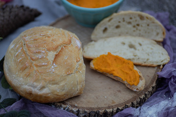 Artisan bread sliced and spread with vegan carrot pate