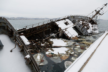 Old fishing ship sank at pier in port