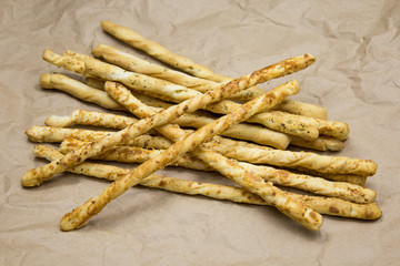 Italian grissini breadsticks on craft paper background 