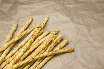 Italian grissini breadsticks on craft paper background 