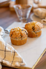 Muffins on modern marble serving board