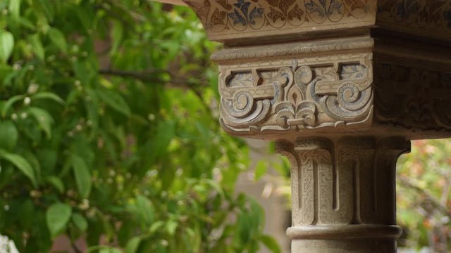Ornaments in chapiter column in ancient muslim palace of Alcazaba, Malaga, Spain