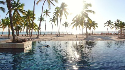 Paradise dream in tropical resort, infinity pool and luxury beach resort in Caribbean sea