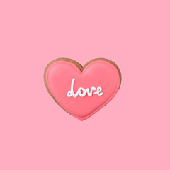 One sweet pink heart on pink background. Valentine's day minimal creative concept. close up. copy space