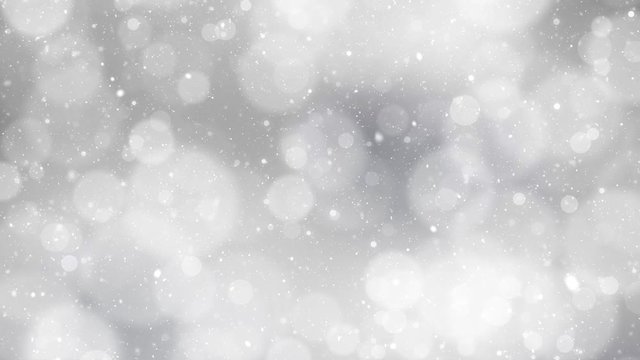 Beautiful silver colored blurry circle bokeh motion background with falling snowflakes. Christmas and New Year copy space decoration animation. 
