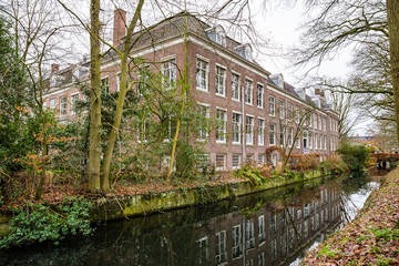 Fototapeta na wymiar Zeist, Netherlands - January 04, 2020. Zusterplein - buildings of orange bricks near Slot Zeist