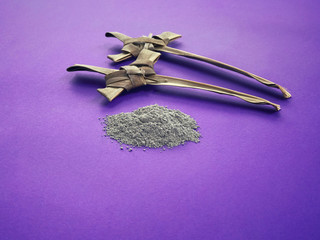 Good Friday, Palm Sunday, Ash Wednesday, Lent Season and Holy Week concept.  A Christian crosses made of palm leaf and ashes on purple background.