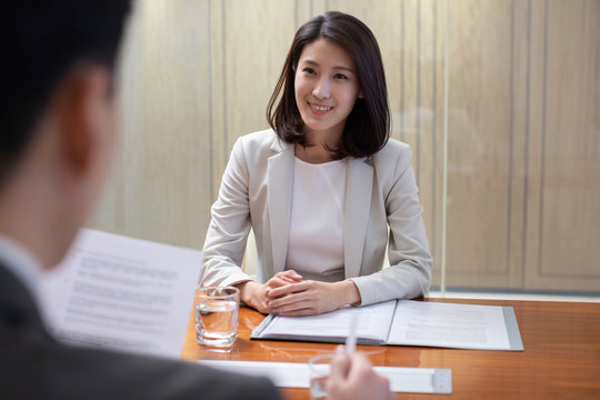 Young Chinese businesswoman in job interview