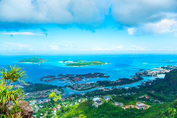 Aerial view of ciity Victoria with blue ocean, coastline and artificial islands.