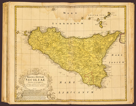 A restored reproduction of an atlas map of the island of Sicily by cartographer Johann Baptist Hofman, circa 1747. This restored, detailed reproduction brings out many details and landmarks.