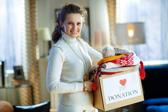 Smiling Woman With Donation Box With Old Warm Clothes