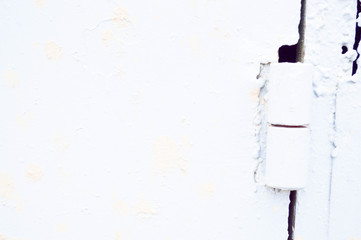 White iron metallic wall. Door with paint painted hinge. Texture, background