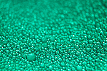 Water drop texture on turquoise background