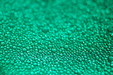 Water drop texture on turquoise background