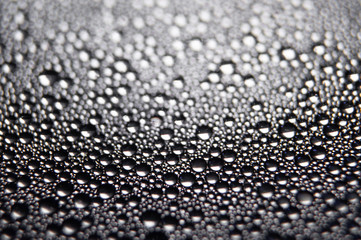 Water drops texture on black background