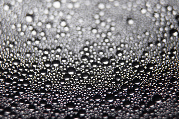 Water drops texture on black background