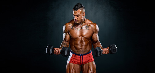 Fototapeta na wymiar Strong Muscular Bodybuilder Lifting Weights