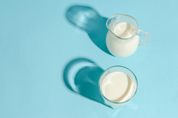 Homemade fermented drink - kefir on a blue background with copy space