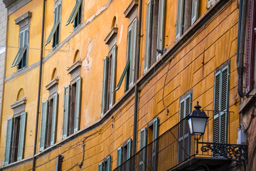 Lots of wooden window frames in Italy from the side