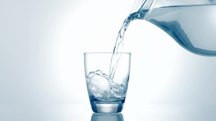 Water pouring into glass - Powered by Adobe