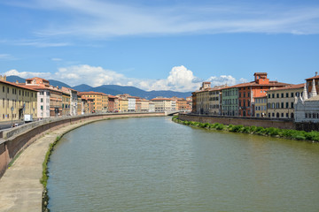 The river Arno going through the tuscan city Pisa