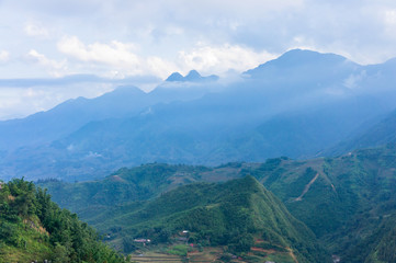 Beautiful scenery of Cat Cat village, popular tourist trekking destination. Rice field terraces.  Mountain view in the clouds. Sapa, Lao Cai Province, north-west Vietnam.