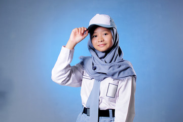 a Muslim high school student is raising his hands above her head to salute