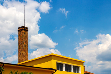 High brick chimney of the old public bath in Kazanlak, Stara Zagora Province, Bulgaria on a sunny summer day