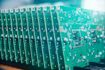a lot of electronic chips close up on a factory production background