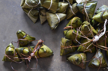 Zongzi or rice dumpling is glutinous rice with sweet or savoury fillings wrapped in bamboo or reed...