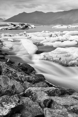Jokulsarlon glacier lagoon in Iceland. Long exposure shot makes, black and white vintage