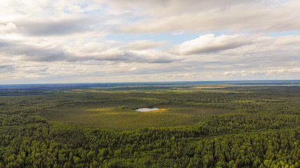 Aerial shooting a magic Taiga lake in Russia