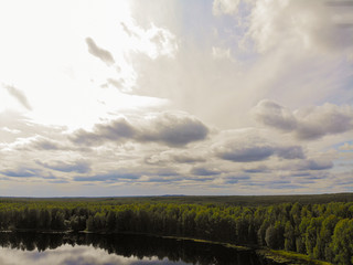 Fototapeta premium Aerial shooting of a magic lake in the taiga of Russia