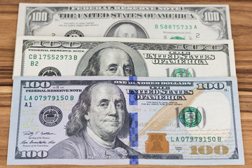 Three types of US one hundred dollar bills, business finance shopping concept. Old banknotes.