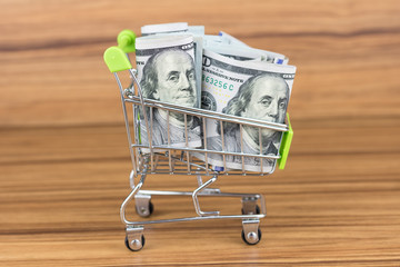 American hundred dollar bills, shopping cart or supermarket cart, business finance shopping...