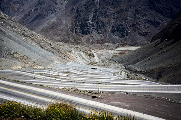 Serpentine road Caracoles Juncal, near valley of Río Juncalillo. Curvy mountain road with many curves going down. Near Chile and Argentina border, Los Andes region in Andes mountains, Chile.