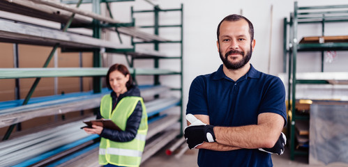 Portrait of warehouse worker looking at camera