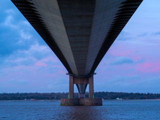 View of the Humber Bridge from below just before sunset, North Lincolnshire, England