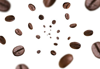 Dark brown roasted coffee beans flying falling on white background. Concept for coffee product...