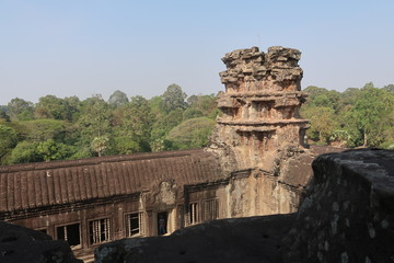 Fototapeta na wymiar forest behind old temple ruins of khmer city angkor wat, cambodia, beautiful tower, monument history