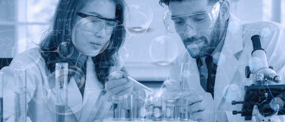 two researcher doing experiment in chemical laboratory