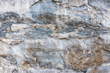 background. destruction of a stone wall