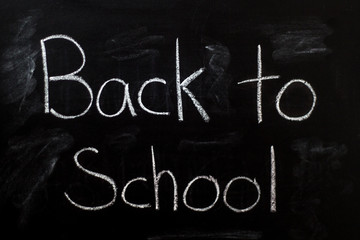 Obraz premium Back to School written in chalk on chalkboard