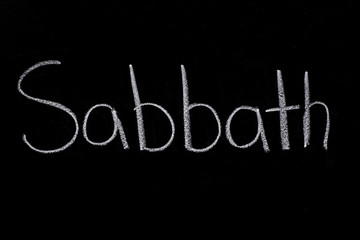 Sabbath written on chalkboard in chalk