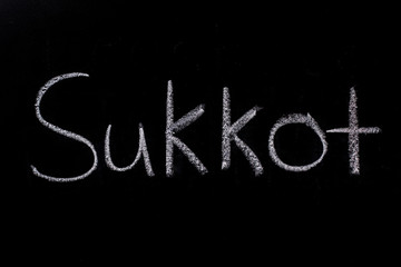 Sukkot written on chalkboard in chalk