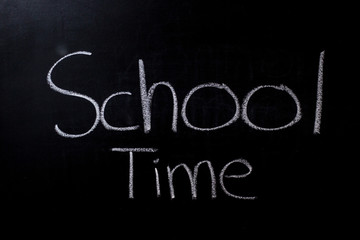 Obraz premium School Time written in chalk on a chalkboard