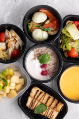 ready meal to eat on grey background. Cream soup, buckwheat
