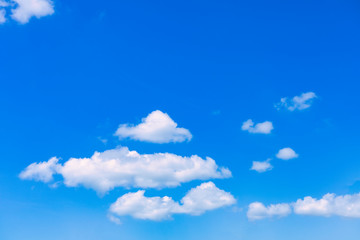 Naklejka na ściany i meble Blue sky with cloud background. With copy space for text or design.