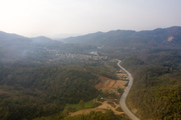 Aerial view of mountain against foggy sky