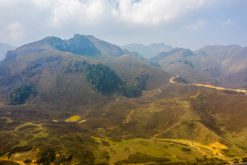 Obraz premium Aerial view of Mountain against foggy sky